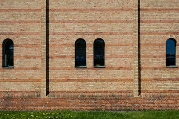 windows on church buildine exterior - brick stone wall -