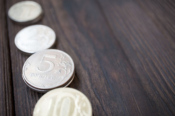 coins on wooden background, business concept, copy space