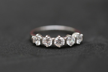 Diamond ring on black background