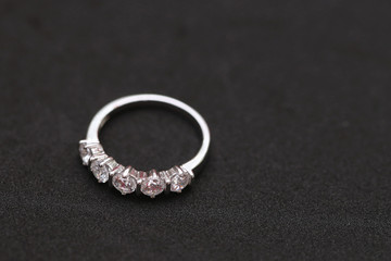 Diamond ring on black background