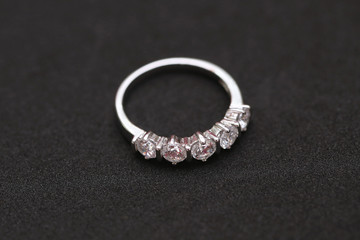 Diamond ring on black background