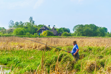 In the spring, fishing on the river