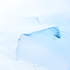 Fototapeta premium Mountain in snow with fog