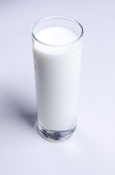 glass of fresh milk on white background.