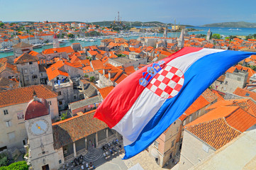 Flag and view on Trogir from Cathedral of Saint Lawrence, Croatia. - 203576319