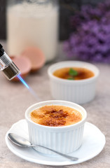 Creme brulee - traditional french vanilla cream dessert with caramelized sugar on top.