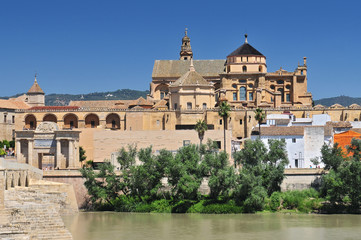 Fototapeta na wymiar Mosque Cathedral (La Mezquita) and Roman Bridge on Guadalquivir river in Cordoba, Spain, Andalusia region.