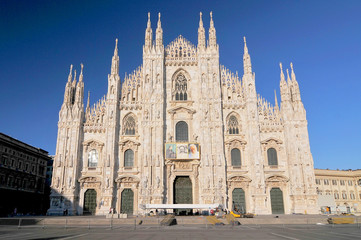 Fototapeta na wymiar Milan cathedral, Duomo di Milano, marble facade with spires, Spain.