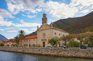 Fototapeta na wymiar Montenegro, view of seaside Prcanj town and Church of Saint Nicholas Franciscan Monastery
