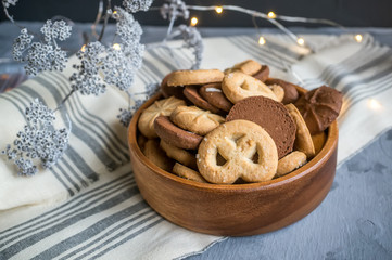 Background with almond and chocolate cookies and on grey vintage table, food concept with copy space, top view