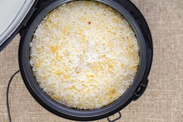 Cooked rice pilaf in a rice maker or steamer