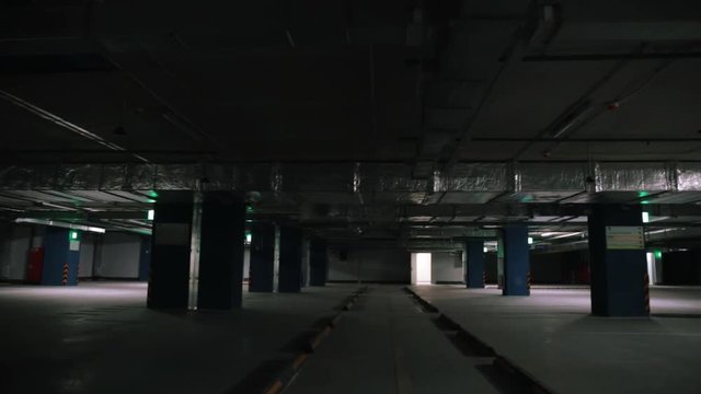 New modern empty underground parking garage for cars, auto park interior inside, toned footage