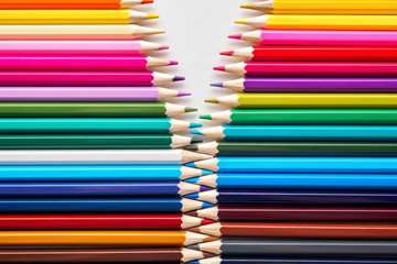 Set of colored pastel pencils in row multi color in form of closed zipper - 203586769