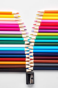 Set of colored pastel pencils in row multi color in form of closed zipper