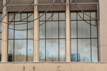 Large windows with wrought iron grating, building facade