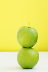 apple on the apple on the yellow background