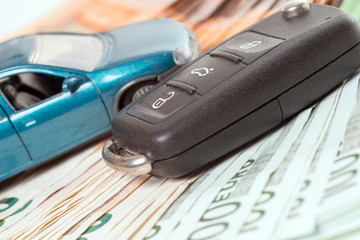 Autokauf / Auto mit Geldscheine und Autoschlüssel
