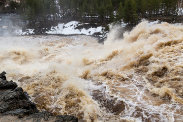 Stormy mountain river with large waves