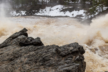 Stormy mountain river with large waves