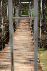 Naklejka na ściany i meble Suspended wooden bridge. the passage is closed on the bridge.