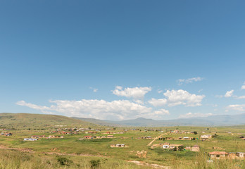 Fototapeta na wymiar Smallholdings with houses and corn fields on road to Injisuthi