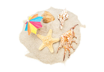 Beach umbrella with seashells on heap of sand. Isolated on white. Top view.