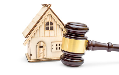 Gavel with model of house on white background. Law and auction concept.