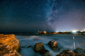 Fototapeta na wymiar Abandoned ship Edro III near Cyprus beach at night.