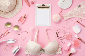 Girls morning ritual concept. Summer style in pink pastel colors. Lace lingerie, cosmetics and accessories