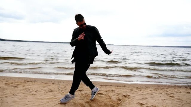 Man Dancing Hip-Hop on the Beach