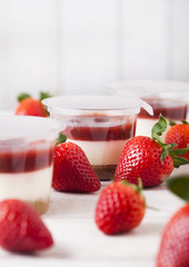 Plastic container with strawberry cream dessert