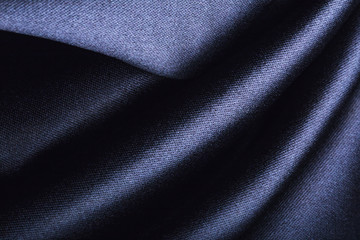 Fototapeta na wymiar Forms of dark fabric texture