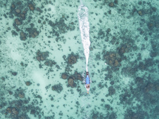 Aerial view of long tail boat Thailand. Clear turquoise water.