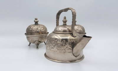 Antique silver pitcher isolated on a white background