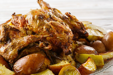 potatoes with meat quails baked at home on the table