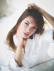 Fototapeta premium Portrait of beautiful young woman face. Isolated on white background.