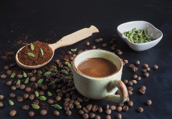 Black coffee with cardamom and dates. Traditional Arabic coffee.