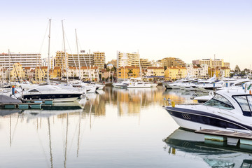 Fototapeta premium Marina with luxurious yachts and sailboats in touristic Vilamoura, Algarve, Portugal