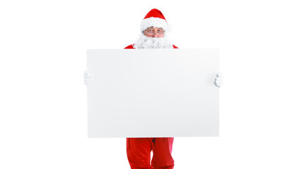 Real Santa Claus carrying big bag full of gifts, isolated on white background.