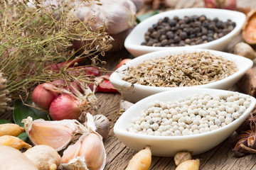 black pepper ,white pepper and ingredient  on wood background concept for herb and spices background