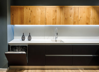Interior of modern kitchen with white counter