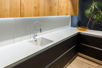 Renovated kitchen interior with white sink