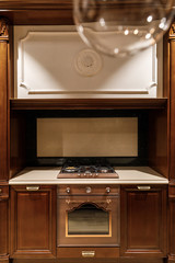 Renovated kitchen interior with stove and oven