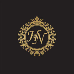 Initial letter HN, overlapping monogram logo, decorative ornament badge, elegant luxury golden color