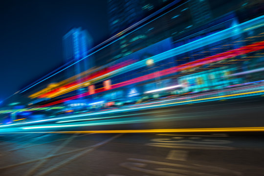 the light trails on the modern building background. © hallojulie