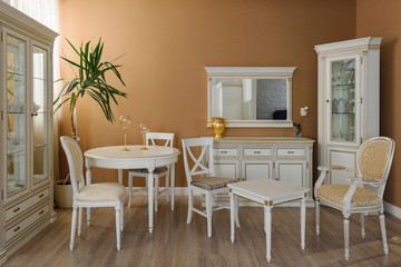 White furniture in elegant dining room