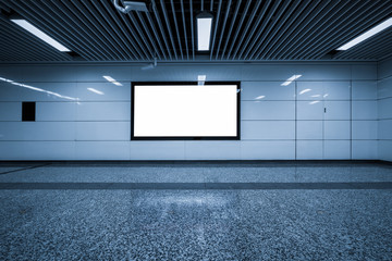 blank billboard on the wall in subway station channel .