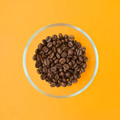 Cup with coffee beans.