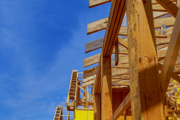 New home construction framing of a house on clear day