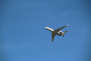 Airplane in clear blue sky